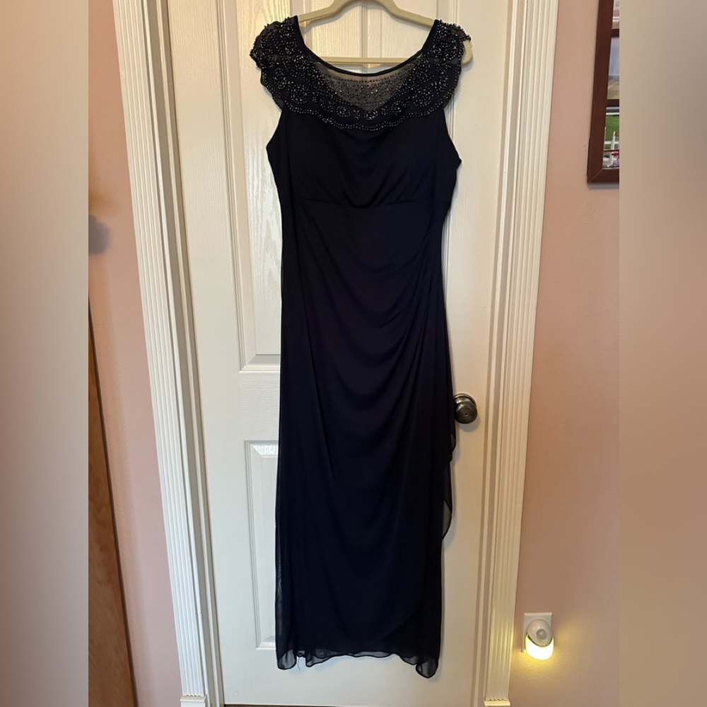 Navy, full length evening gown. Like new. Stretchy, comfortable and flattering